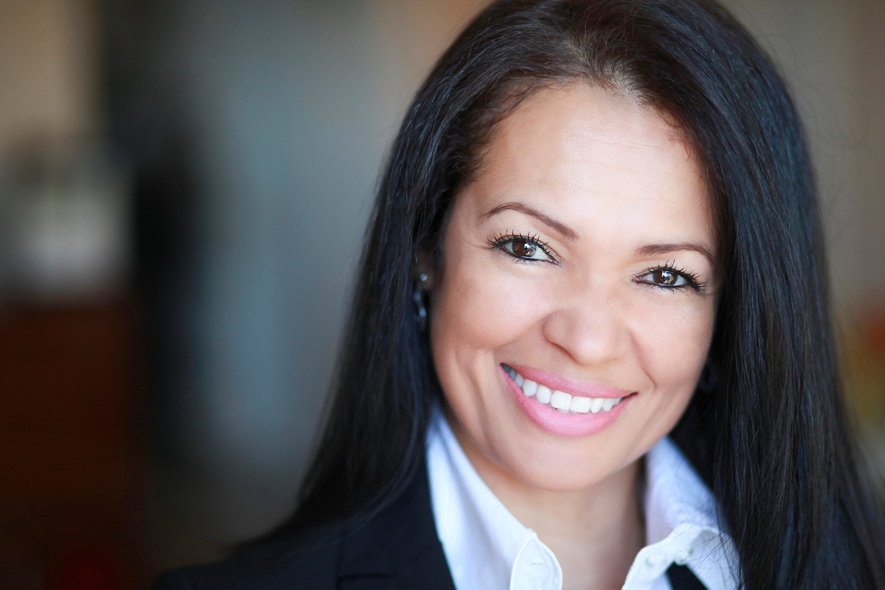 Portrait Of A Spanish Businesswoman Smiling At The Camera