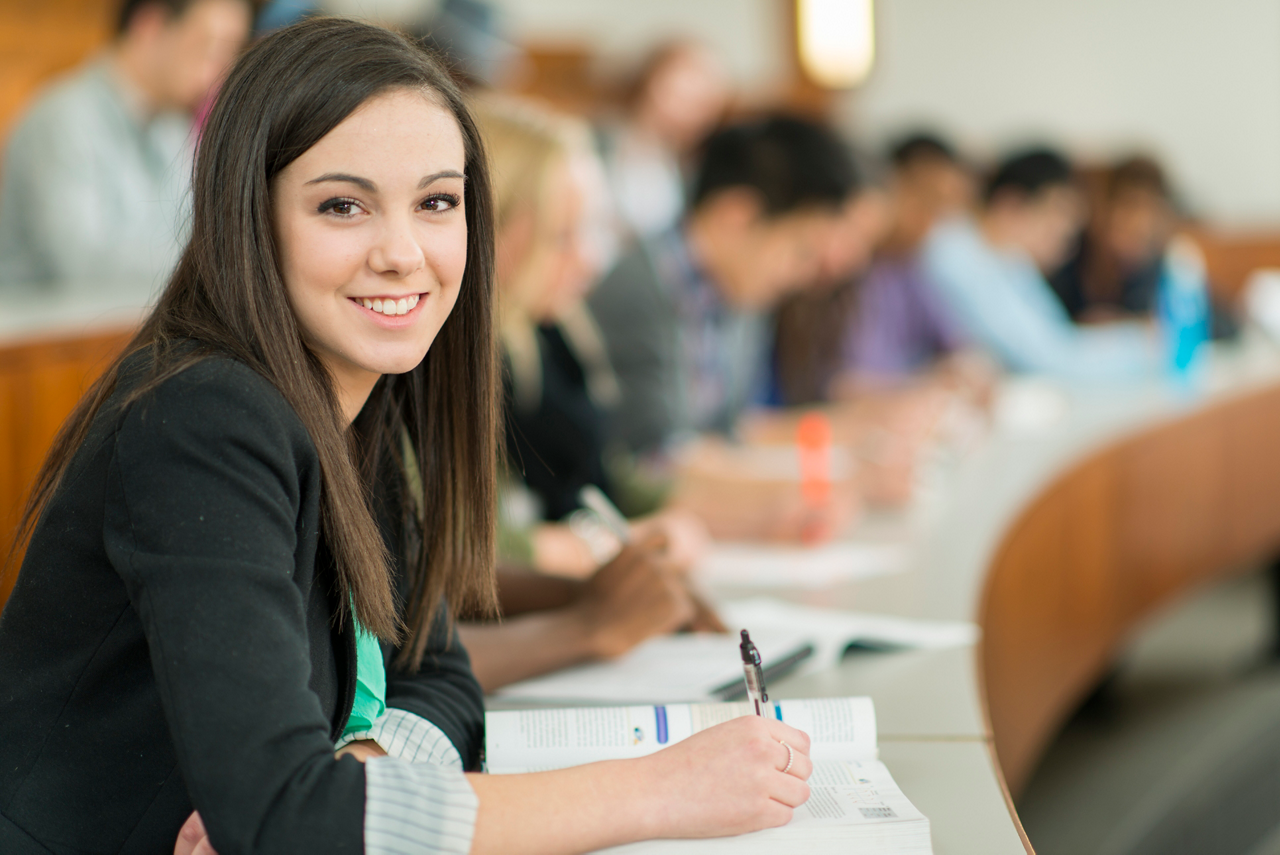 Group of university students studying.