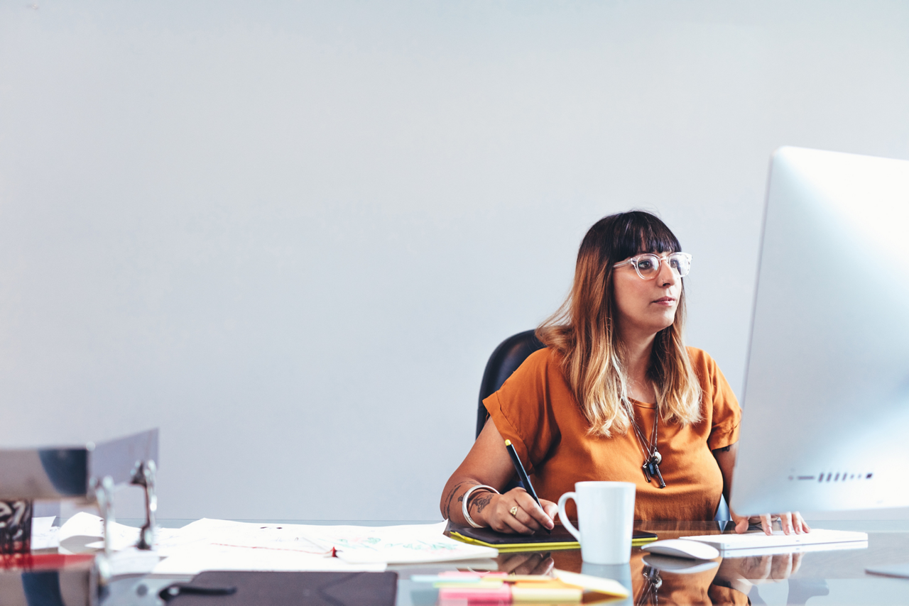Woman working desk desktop writing