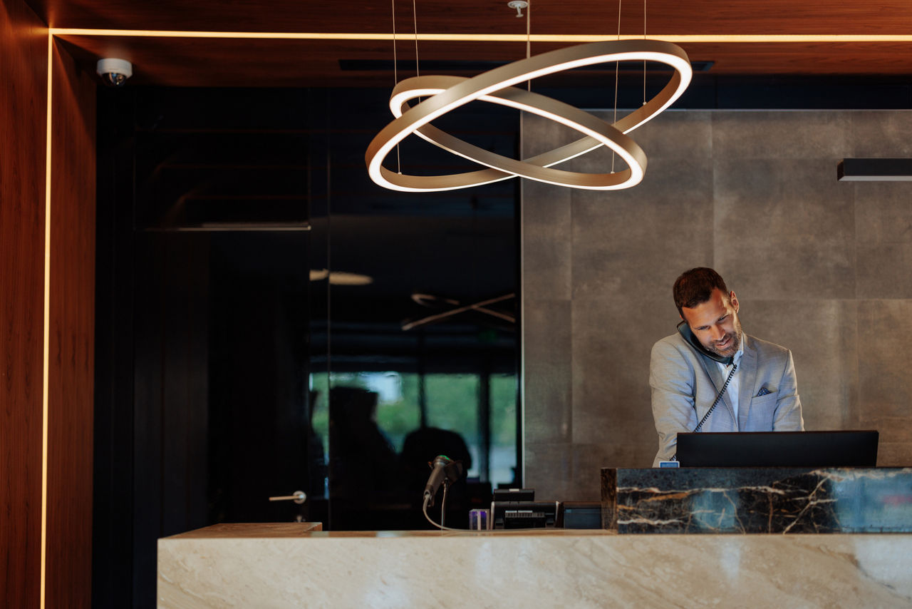 Front desk employee on phone