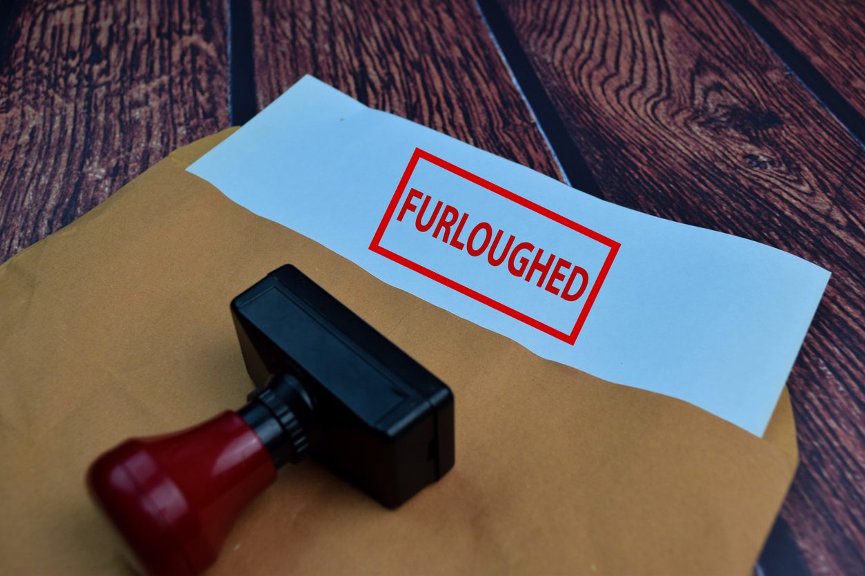 stamp and folder labeled furloughed