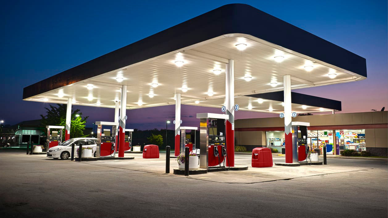 An image of a gas station at night.