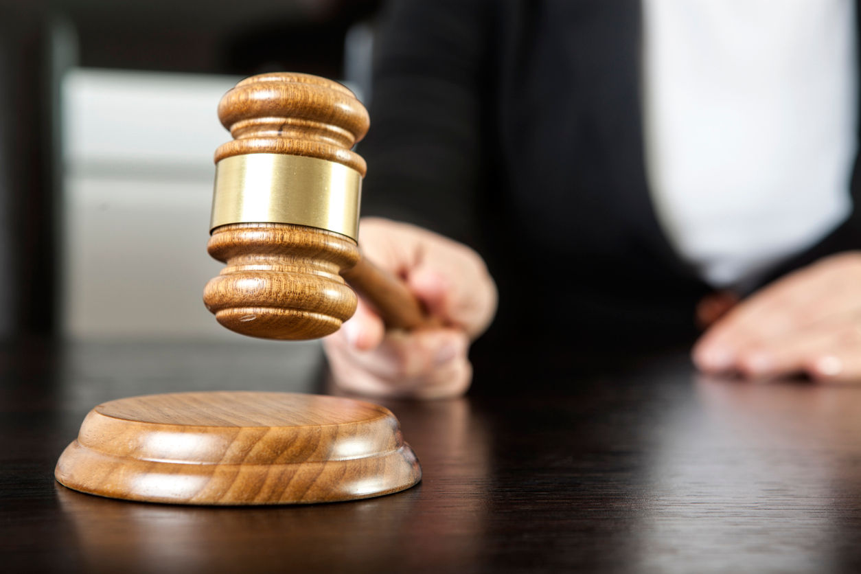 A judge with a gavel.