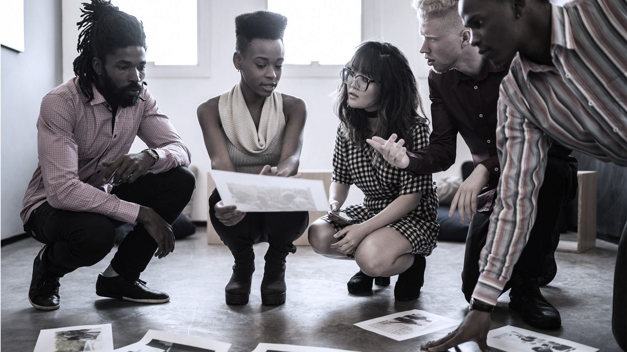 young employees talking at office