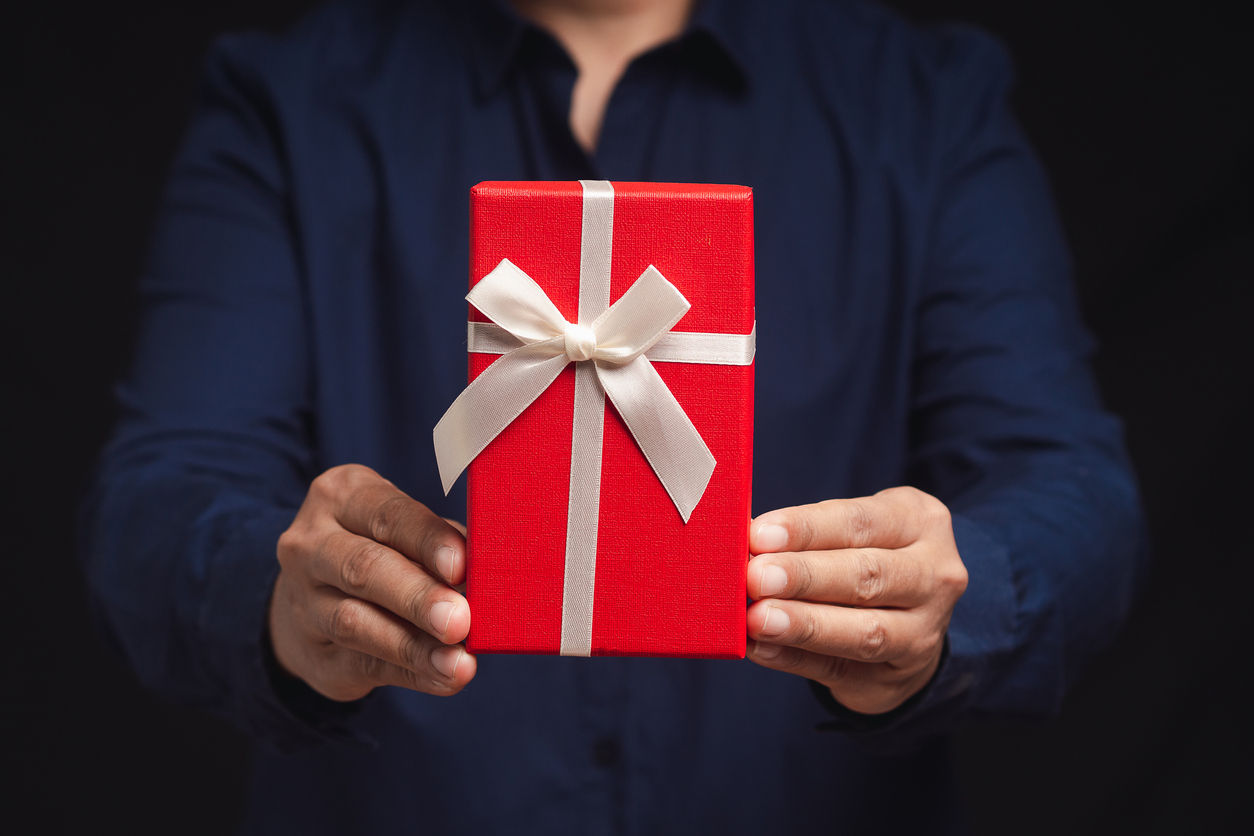 person holiding gift