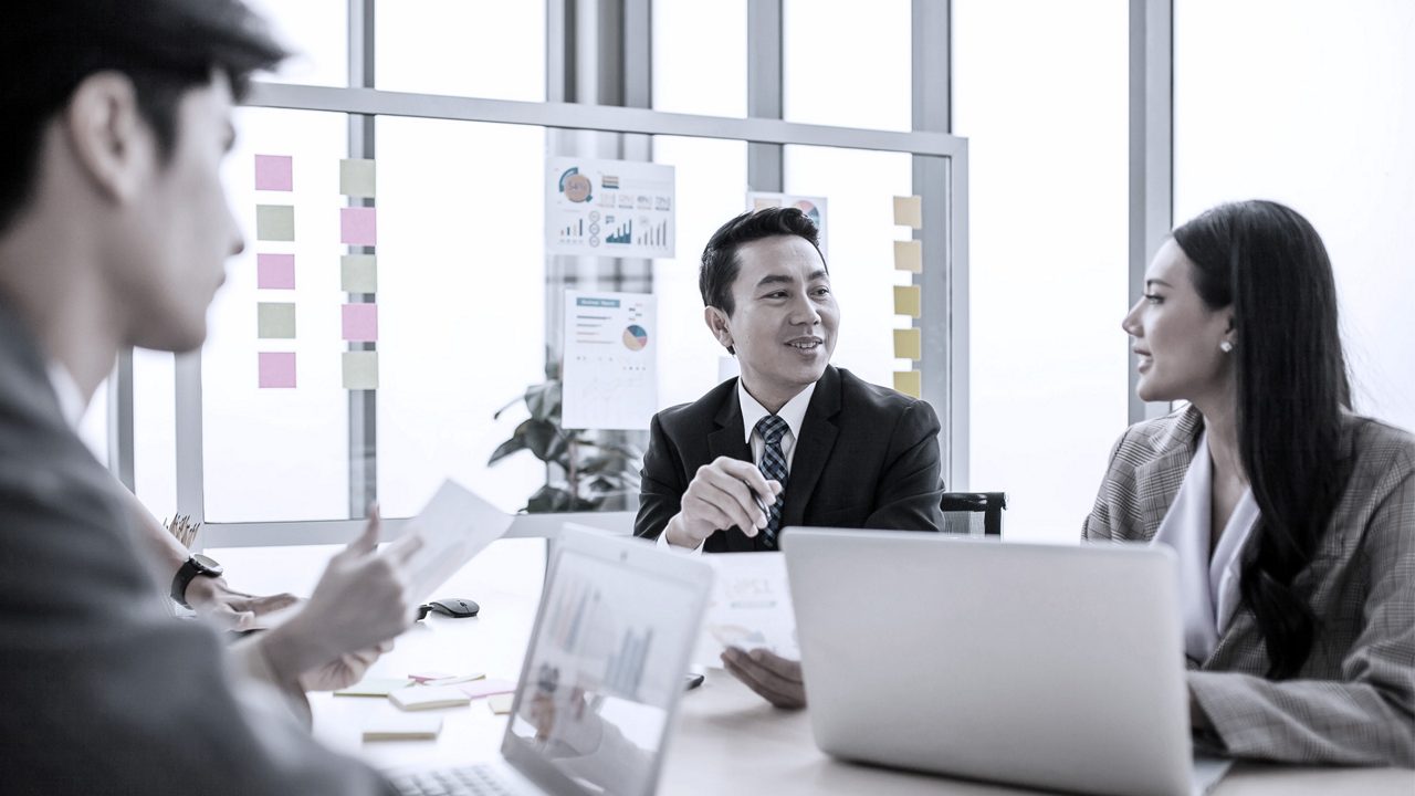 Coworkers sitting at a table in a meeting