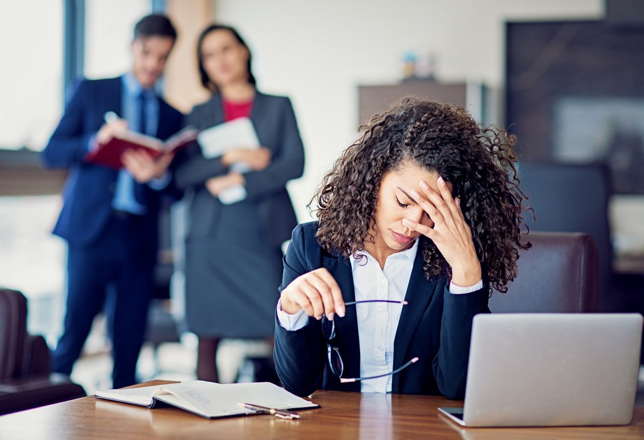 Burnout businesswoman under pressure in the office