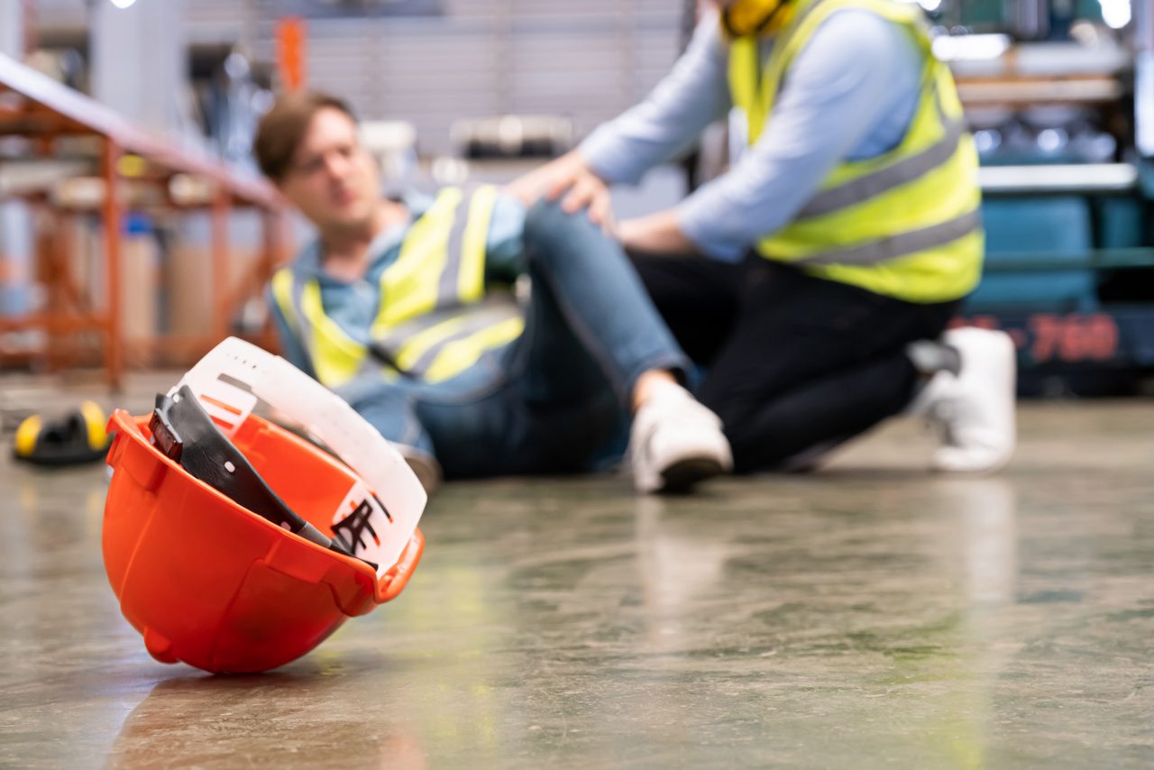 Man injured in warehouse, hard hat falls off