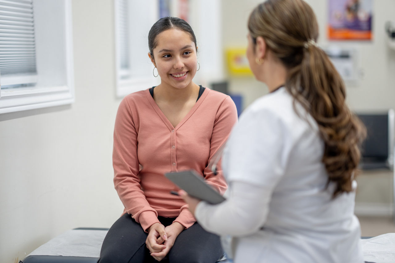 Woman speaking to doctor