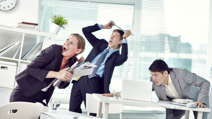 A group of business people are arguing in an office.