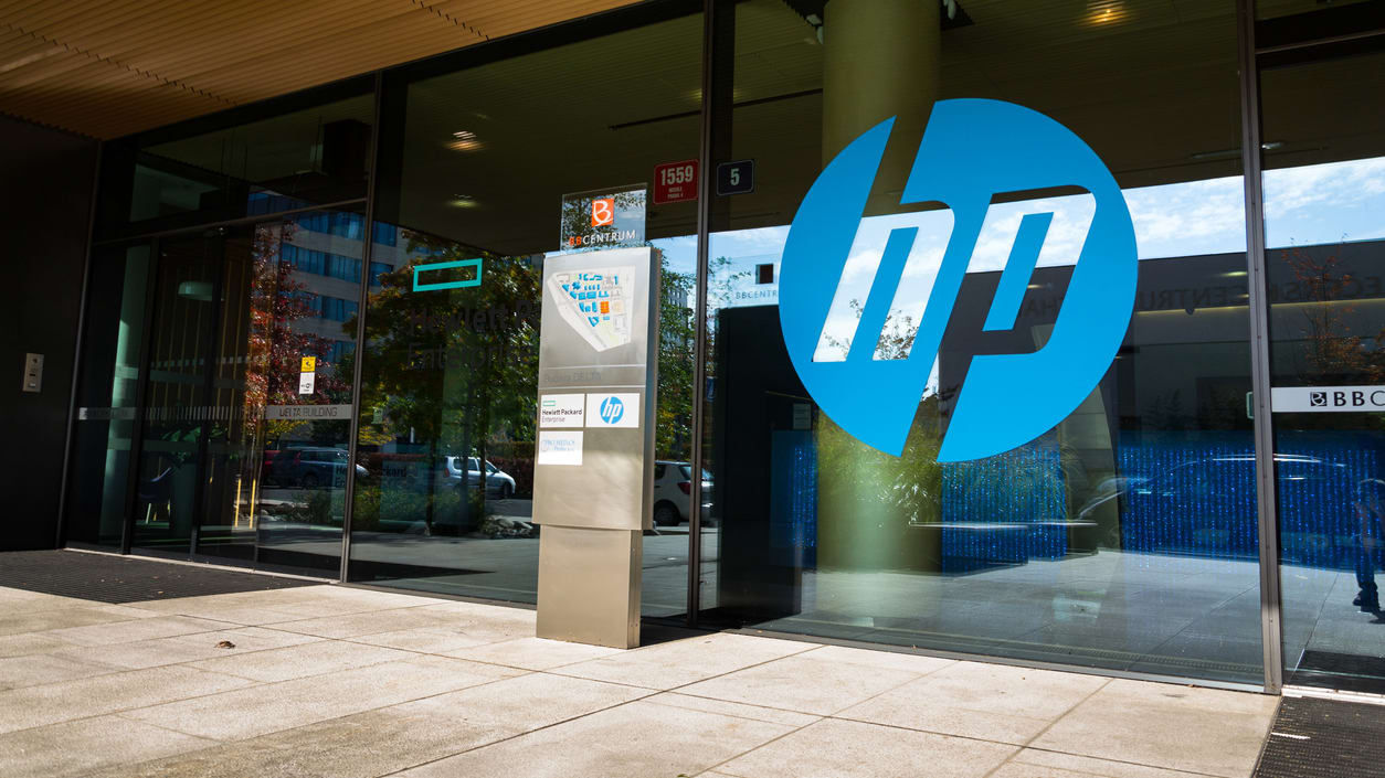 Hp logo in front of a glass door.