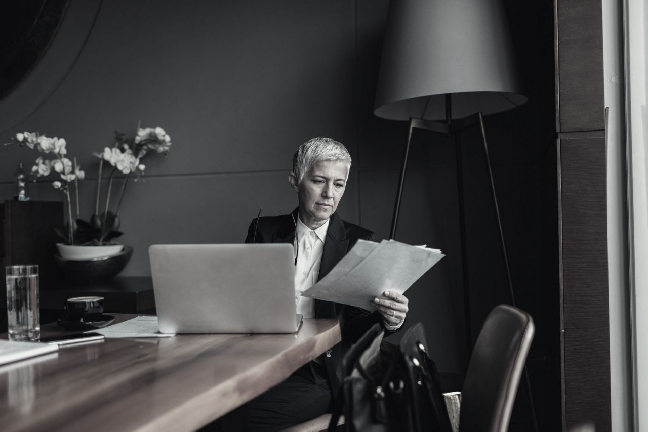 businesswoman reading and working