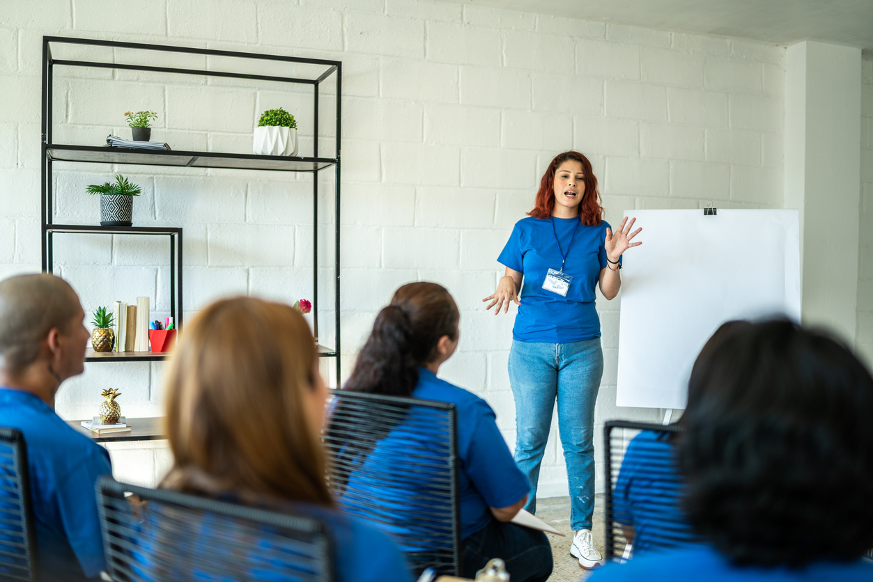 Volunteer woman showing her ideas and plans on a community center