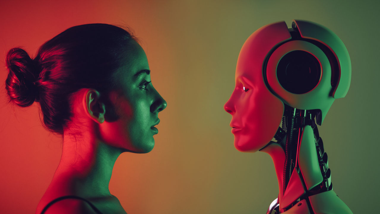 human and robot facing each other and looking into each others eyes