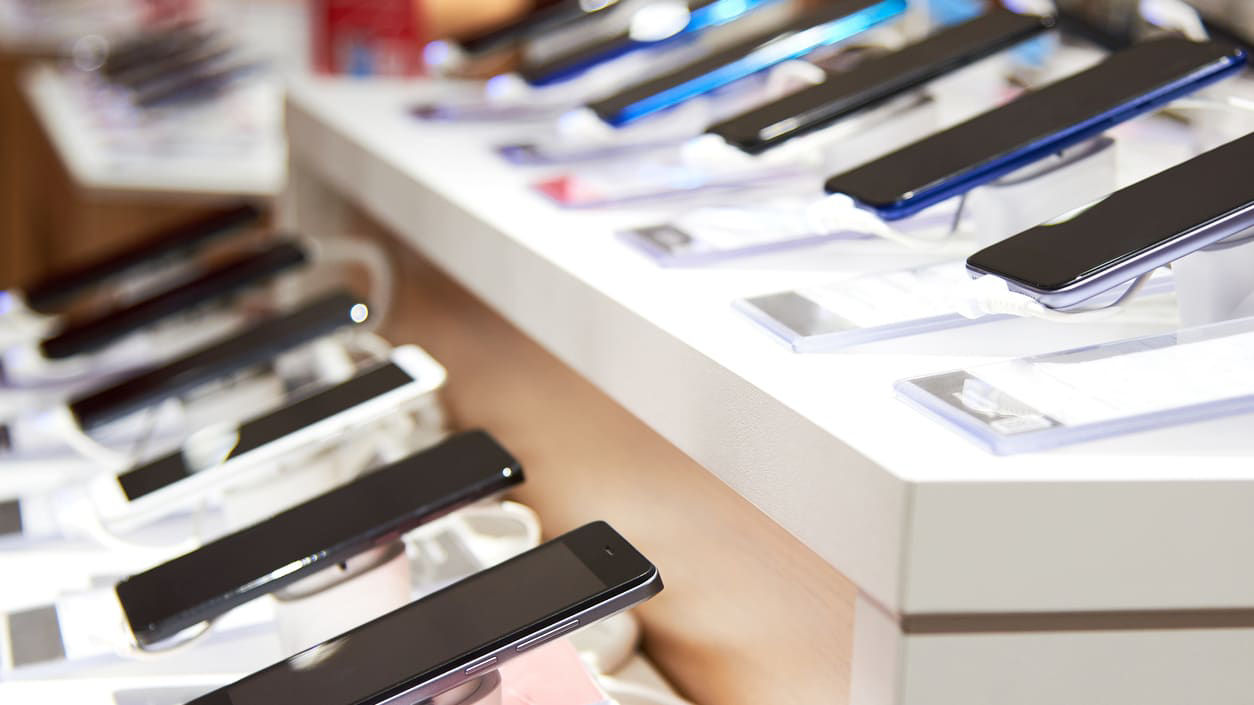 A display of cell phones in a store.
