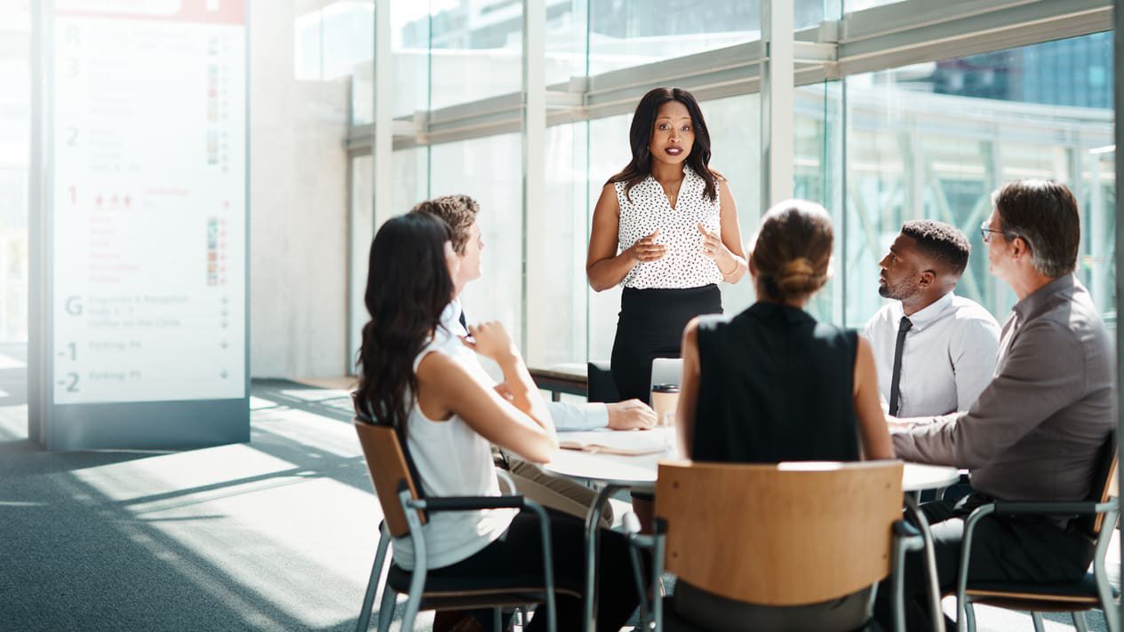 A group of business people in a meeting room.