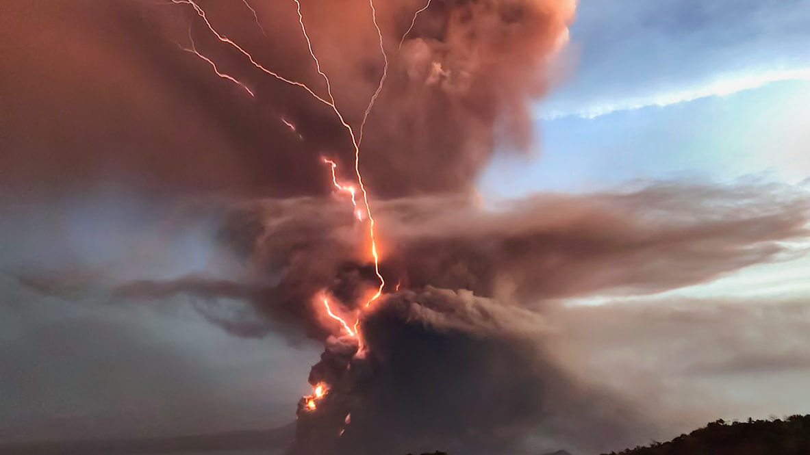 A lightning bolt is coming out of a volcano.