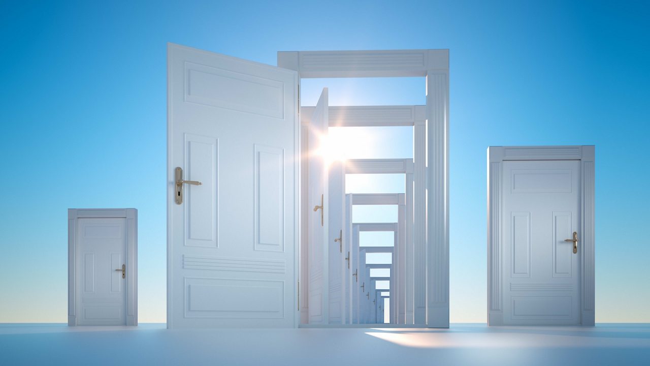 Open doors leading to a bright blue sky.