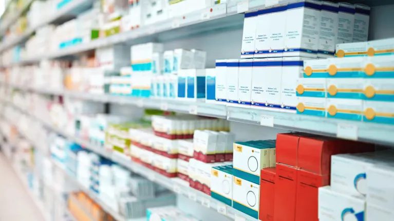 medications on a shelf at a pharmacy