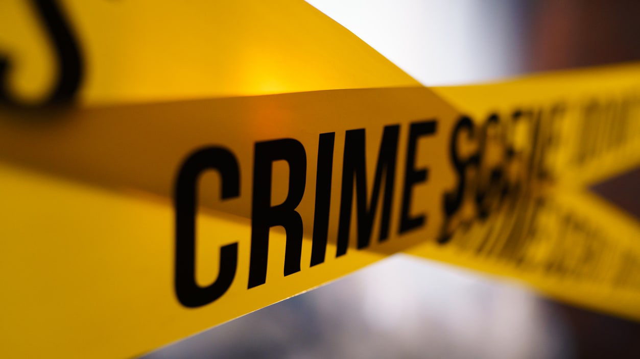 A close up of a yellow crime tape.