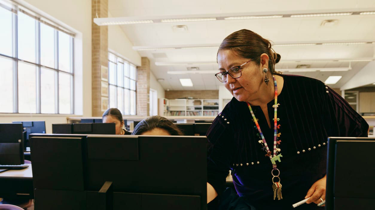 A woman working on a computer.