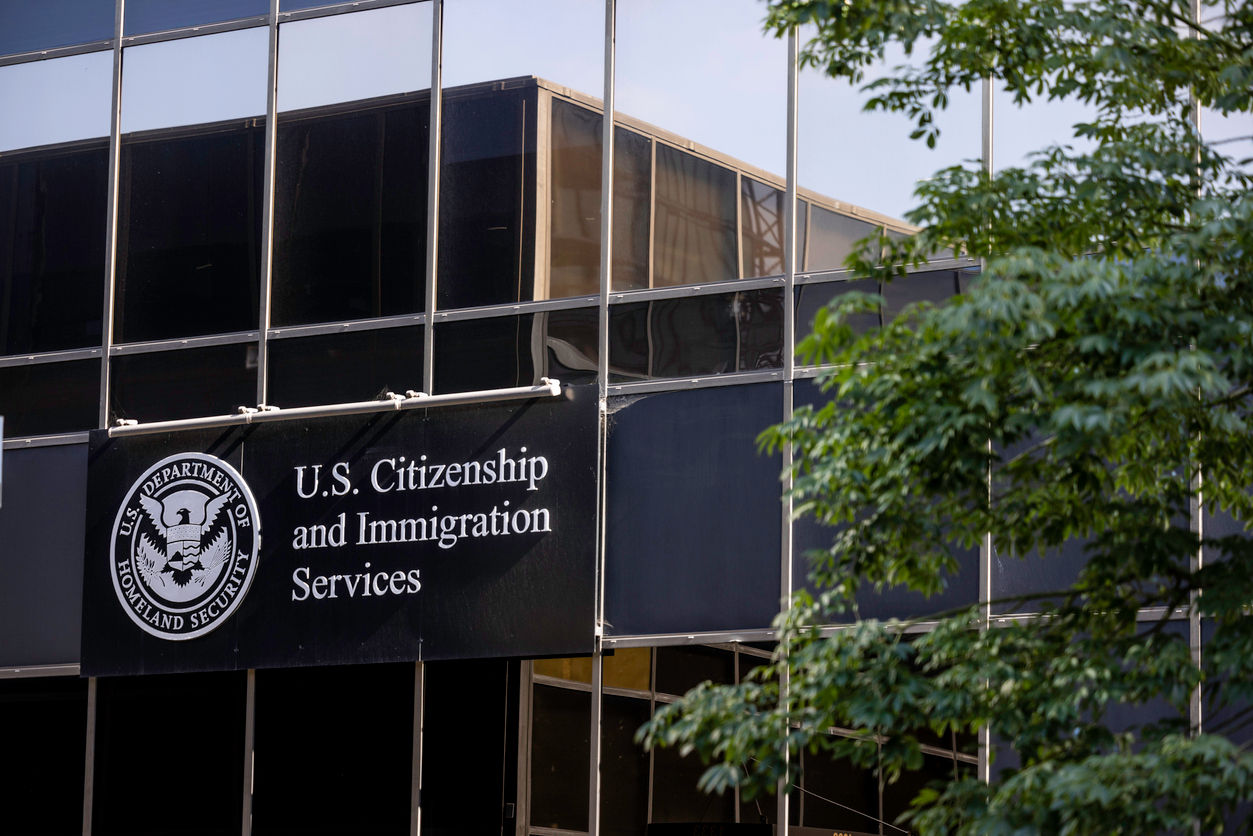US Citizenship and Immigration Services logo featuring an eagle and shield, symbolizing immigration and citizenship services.