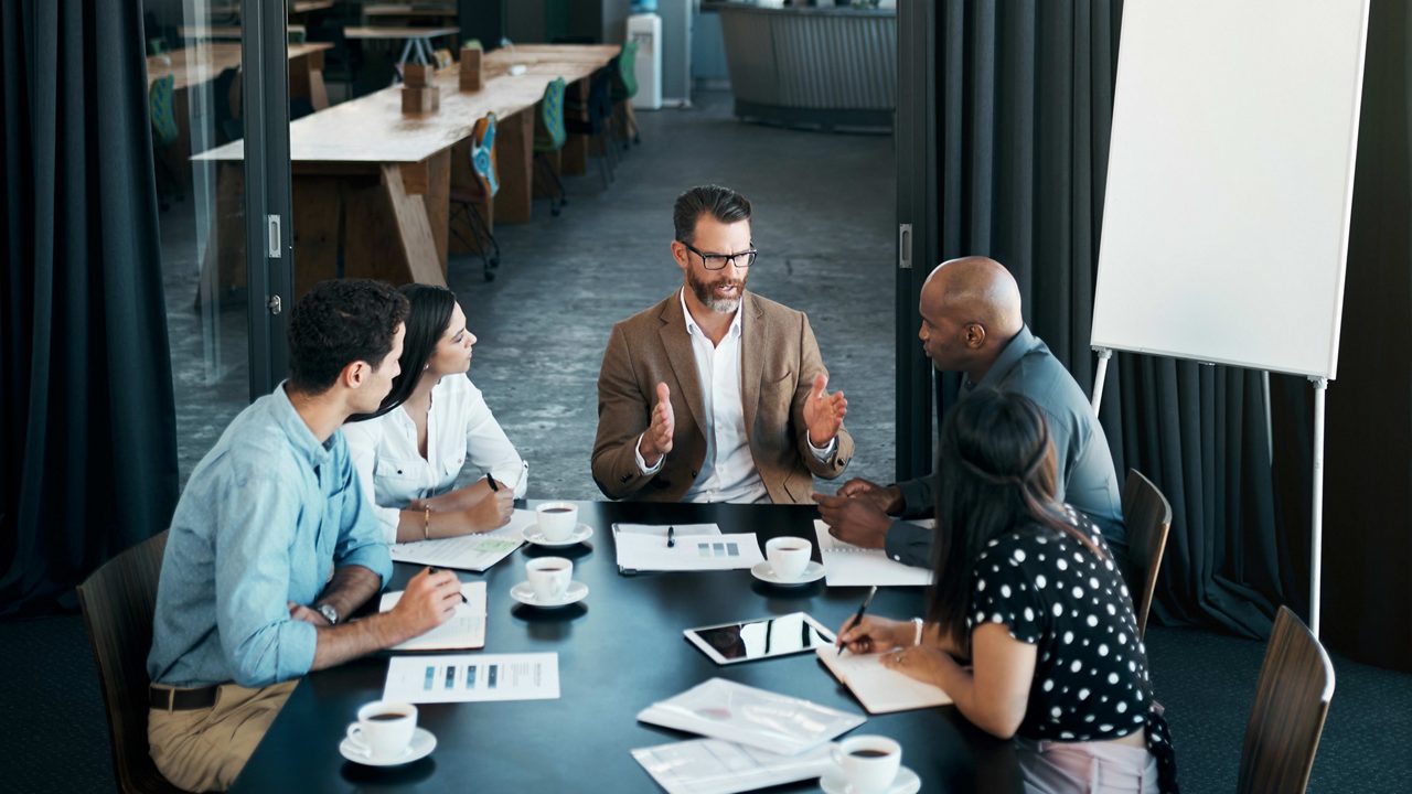 A group of business people having a meeting in a conference room.