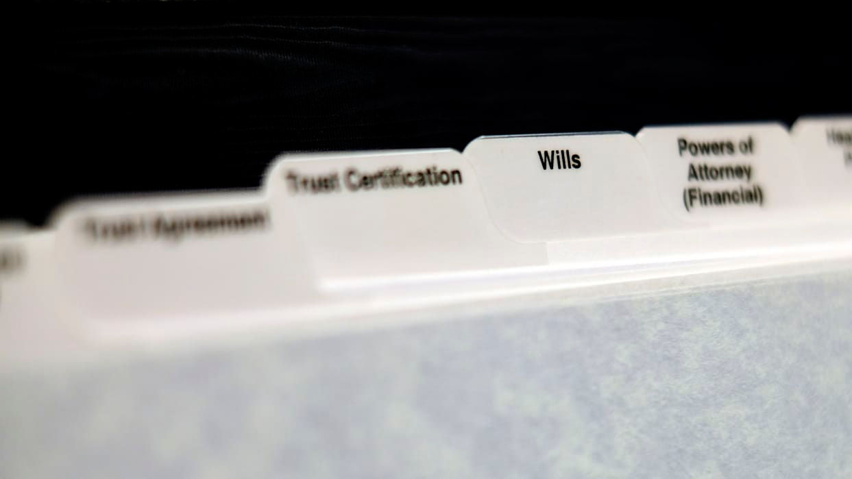 A close up of a file folder with names on it.