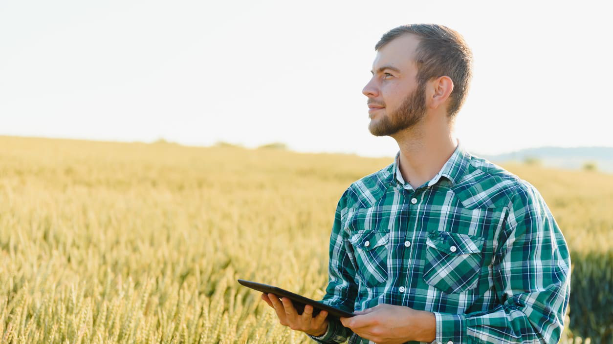Young man standing in a field