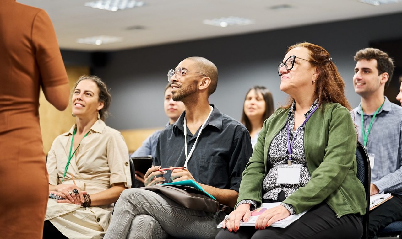 group of employees listening during meeting