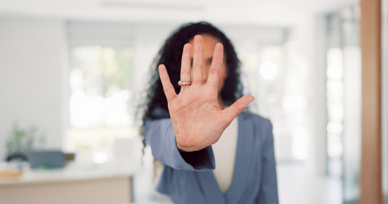 Business woman and face with stop hand for assertive and serious gesture for rejection at workplace. Corporate black woman in office portrait with palm zoom for warning, discrimination or harassment