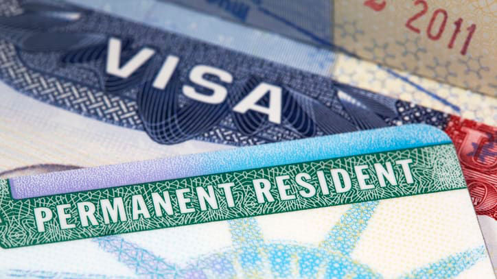 Permanent resident visas are stacked on top of each other.