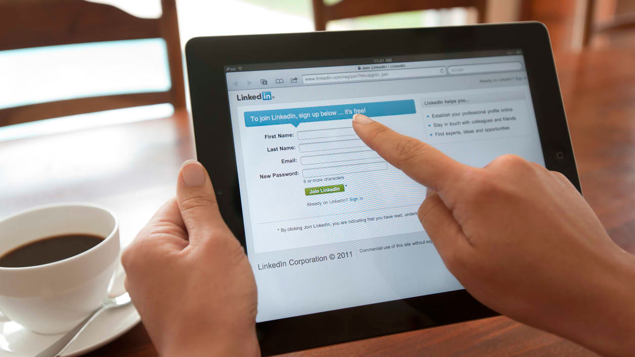 A person using an ipad to log into a website.