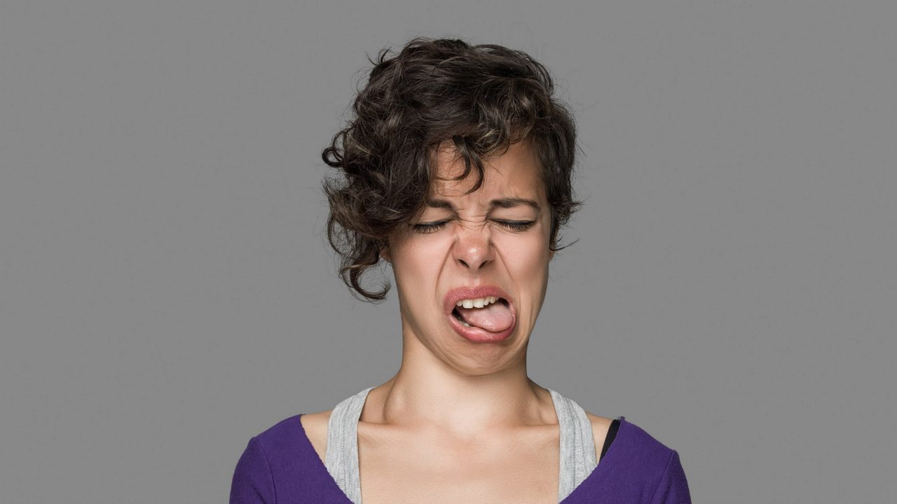 A young woman is making a funny face.