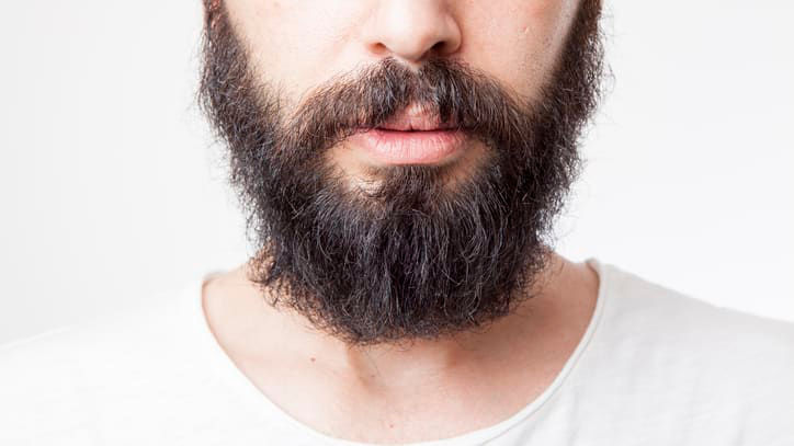 A man with a beard looking at the camera.
