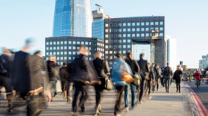 Businesspeople walking in a modern business district of London