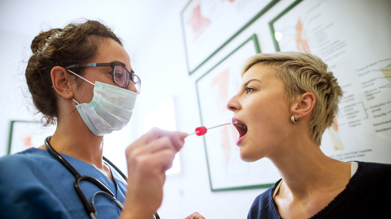 A doctor is giving a patient a syringe.