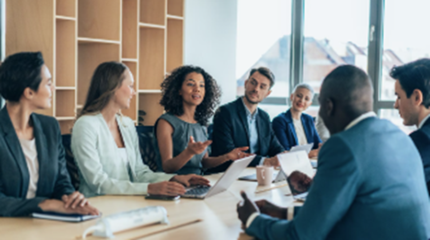 Executive Network - Employees in a conference room.