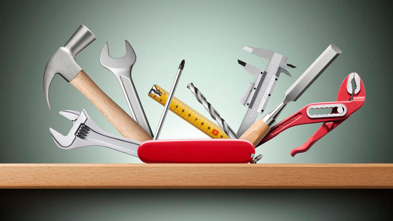 A set of tools on a shelf.