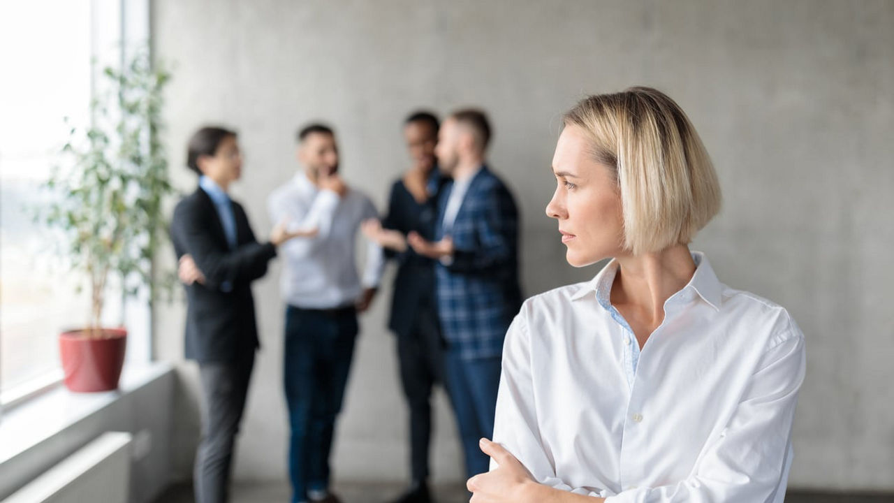 A group of business people standing in front of each other.