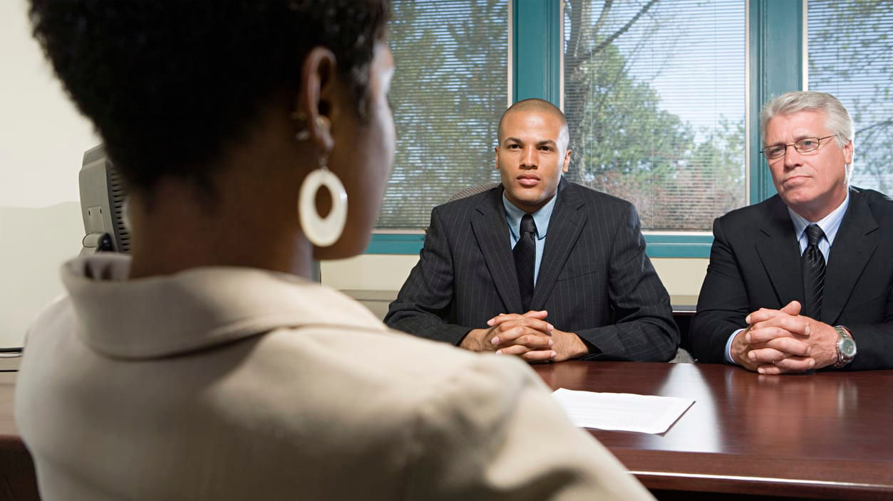 A woman sitting at a desk.