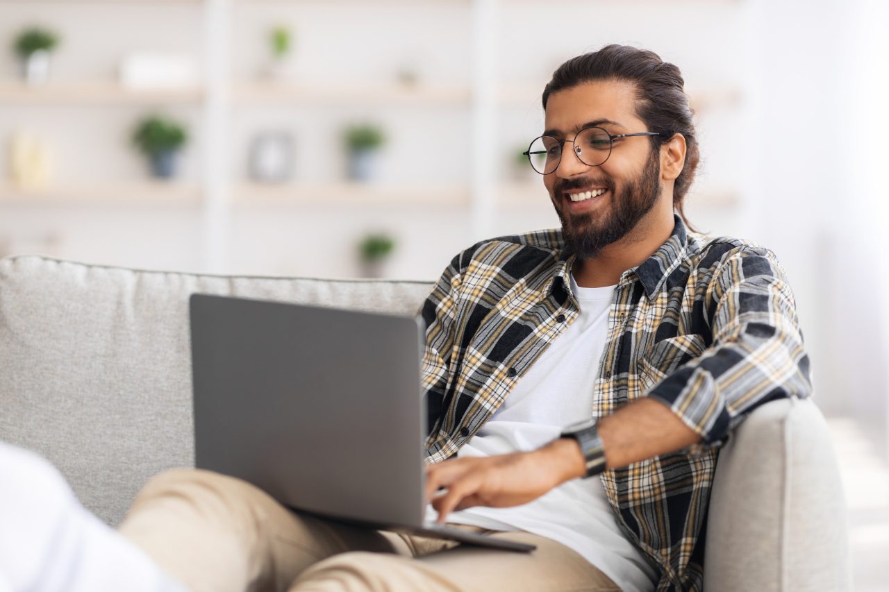 Happy man on laptop