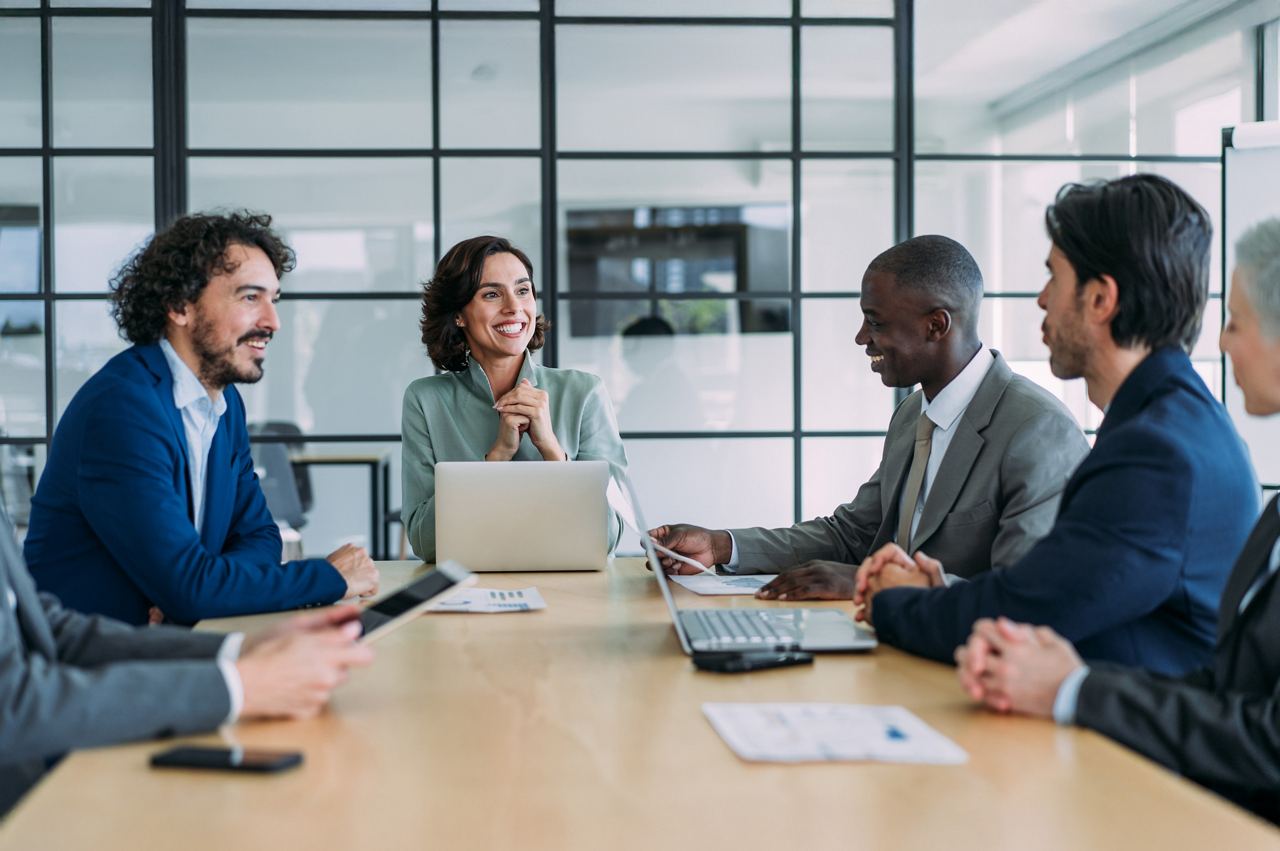 Group of business persons in business meeting. Group of entrepreneurs on meeting in board room. Corporate business team on meeting in the office.