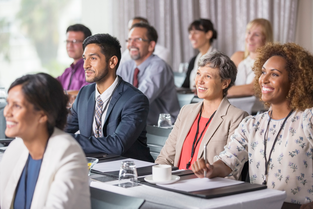 Employees listening to presentation