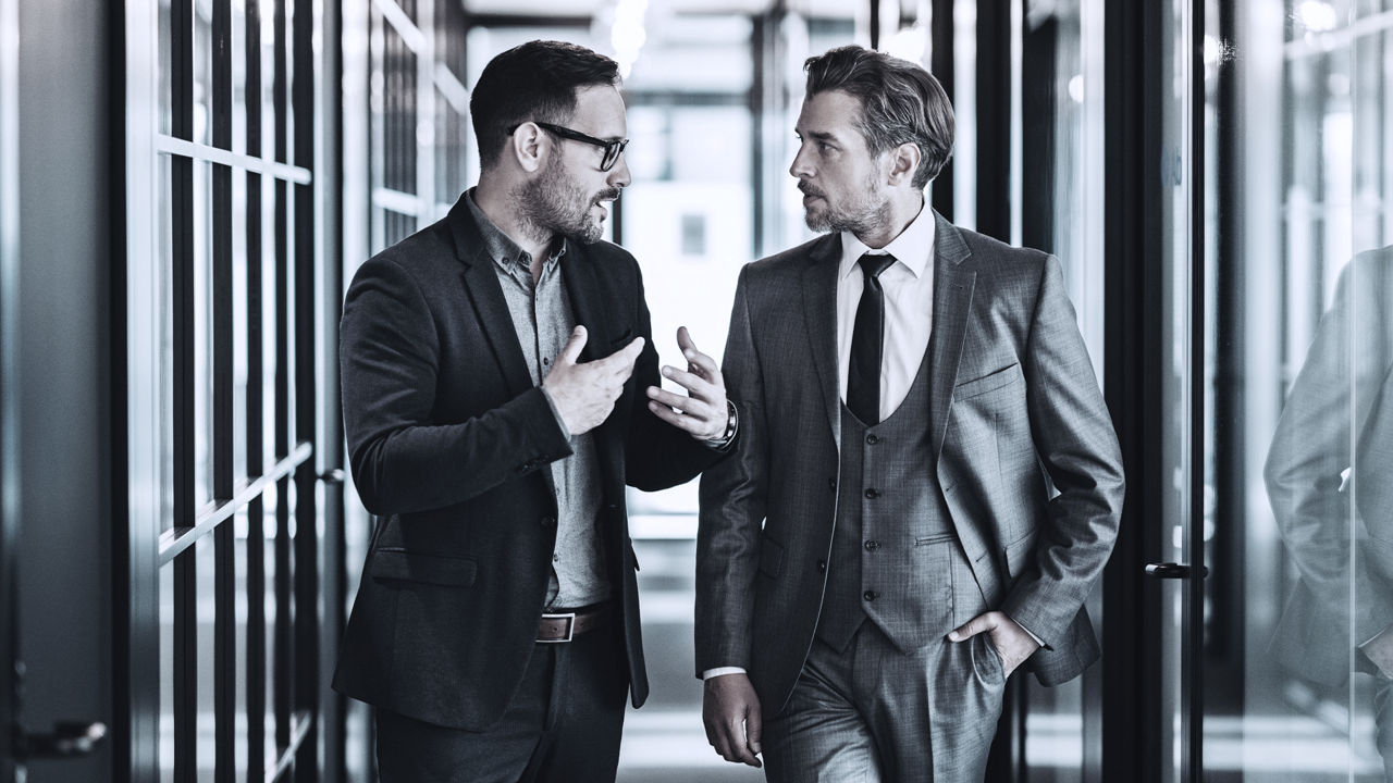 two leaders talking about skills advantage and improving  employee retention