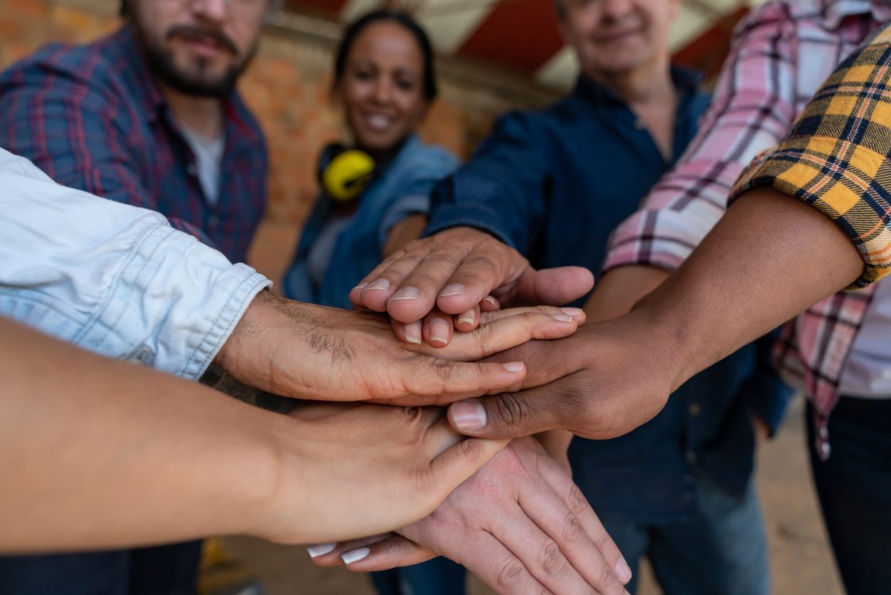 workers  join hands