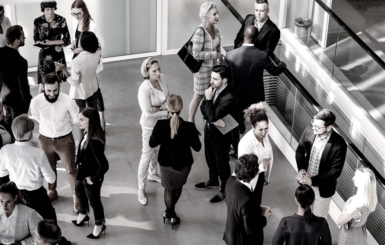 group of business standing and chatting