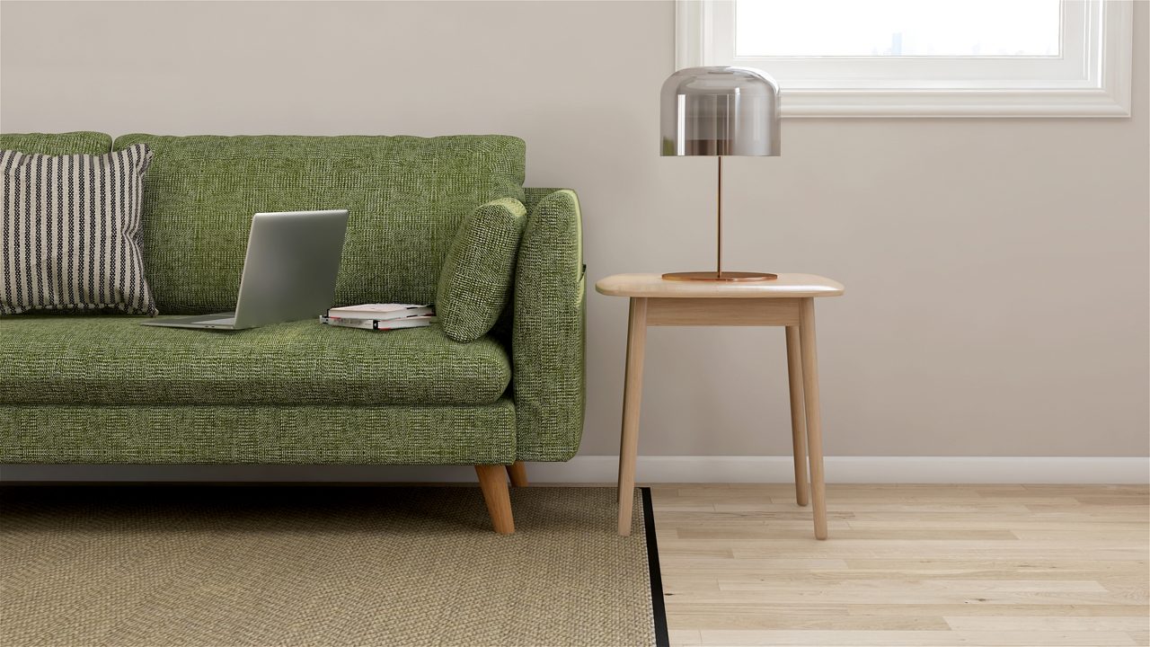 empty couch with a laptop on it