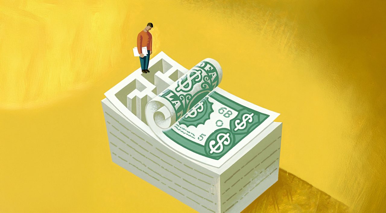 A man balances on a high pile of money with the top peeled back to show a maze within the stack, illustrating the challenges related to navigating minimum wage laws.