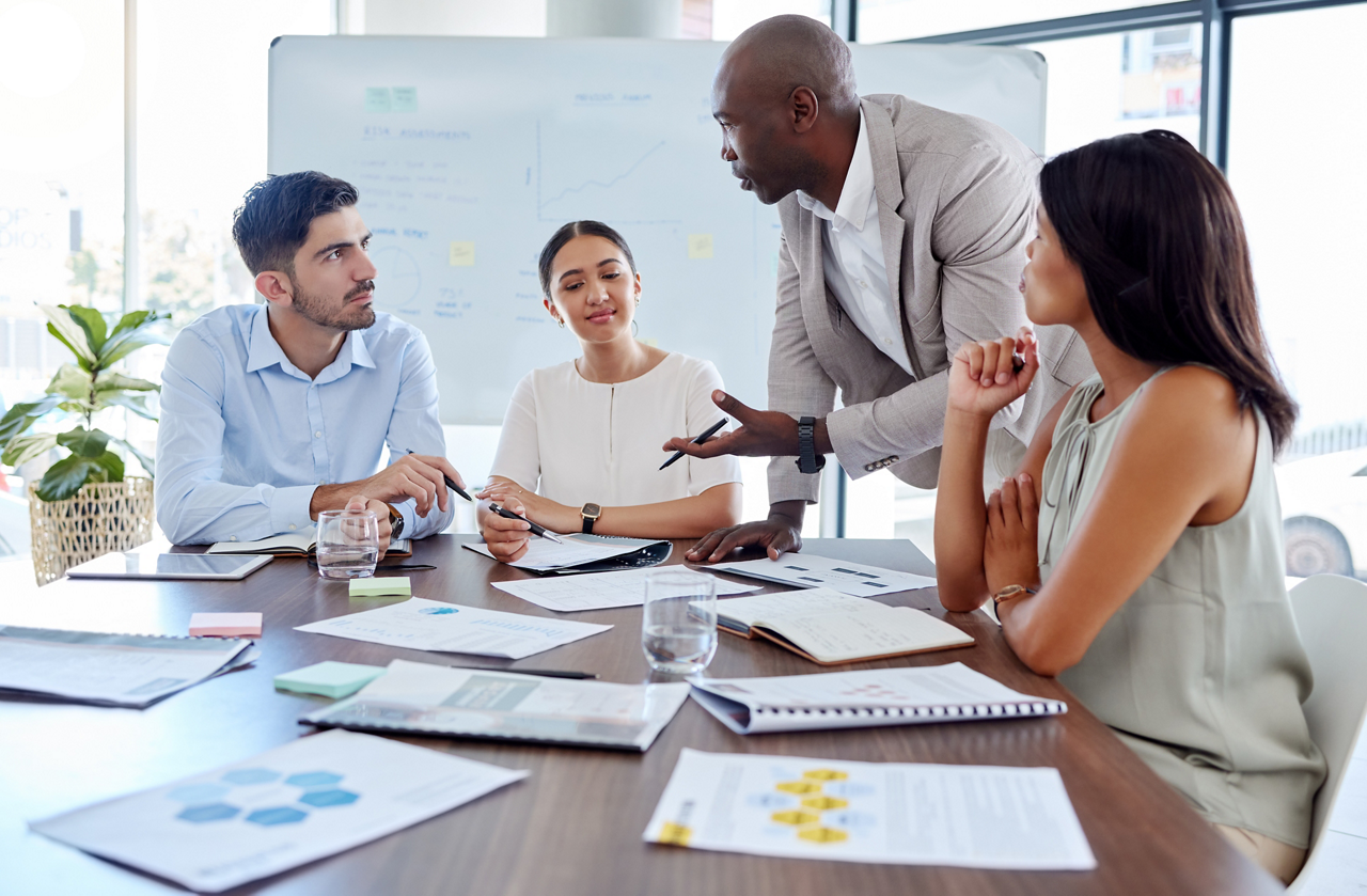 Business people discussing upcoming work in a meeting.